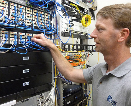 Server room with HG&E employee 